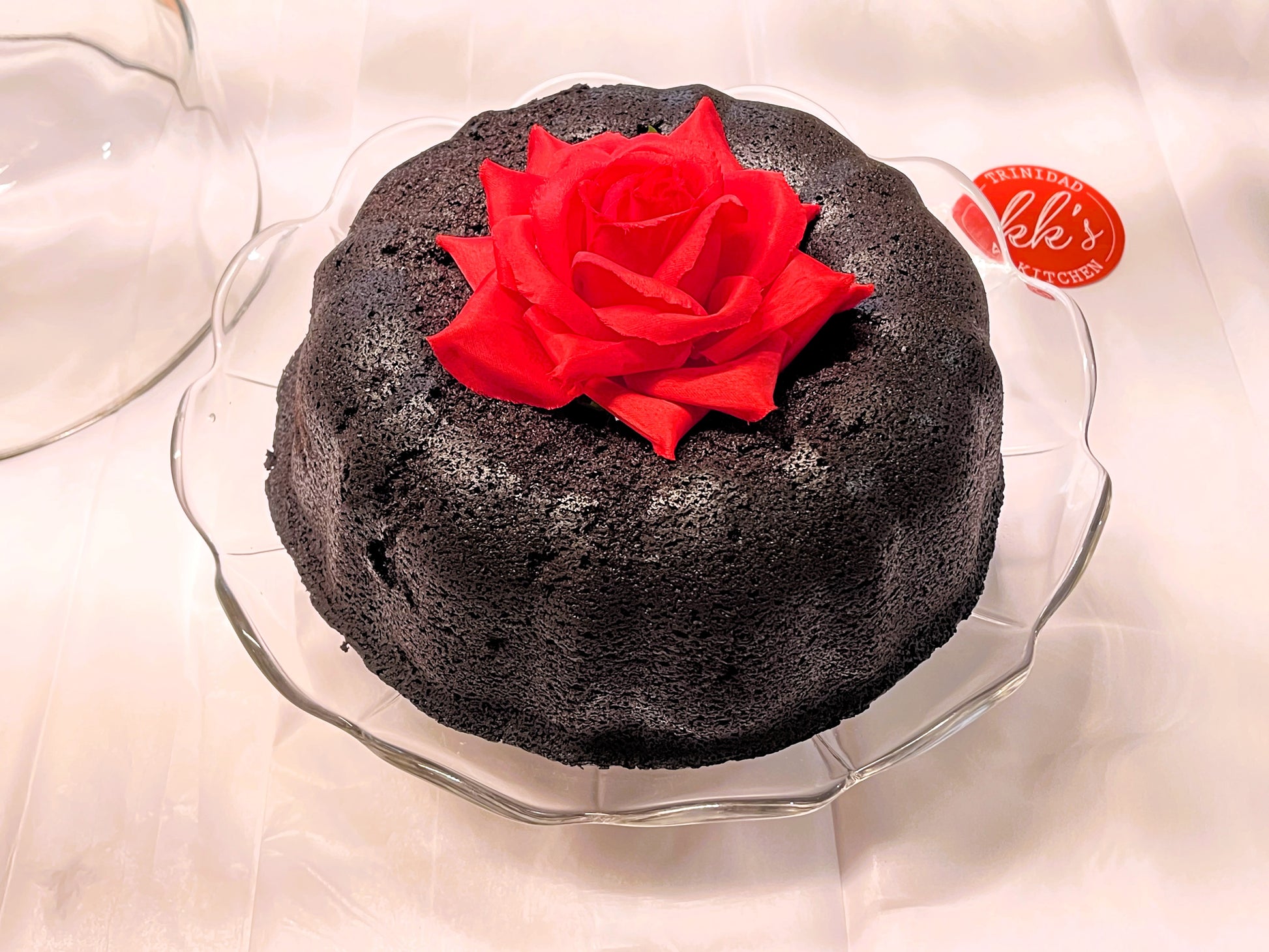 KK's Trinidad Kitchen Black Cake bundt with rose decoration