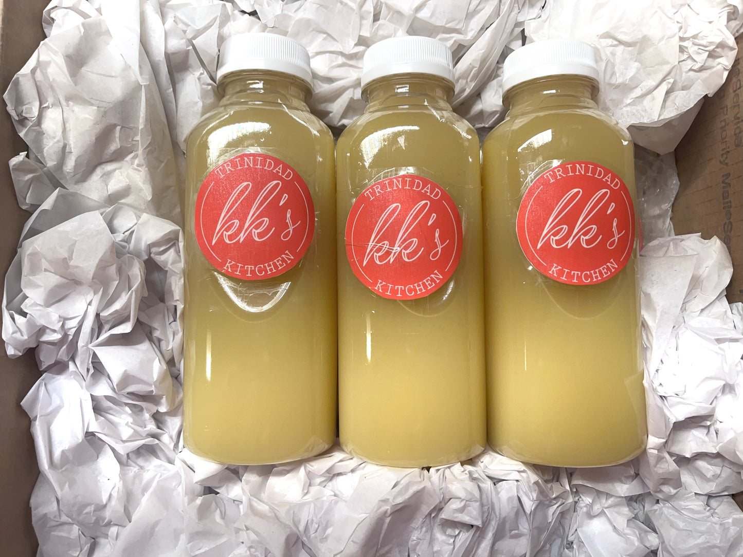 Three 16oz bottles of KK's Trinidad Ginger Beer in a box