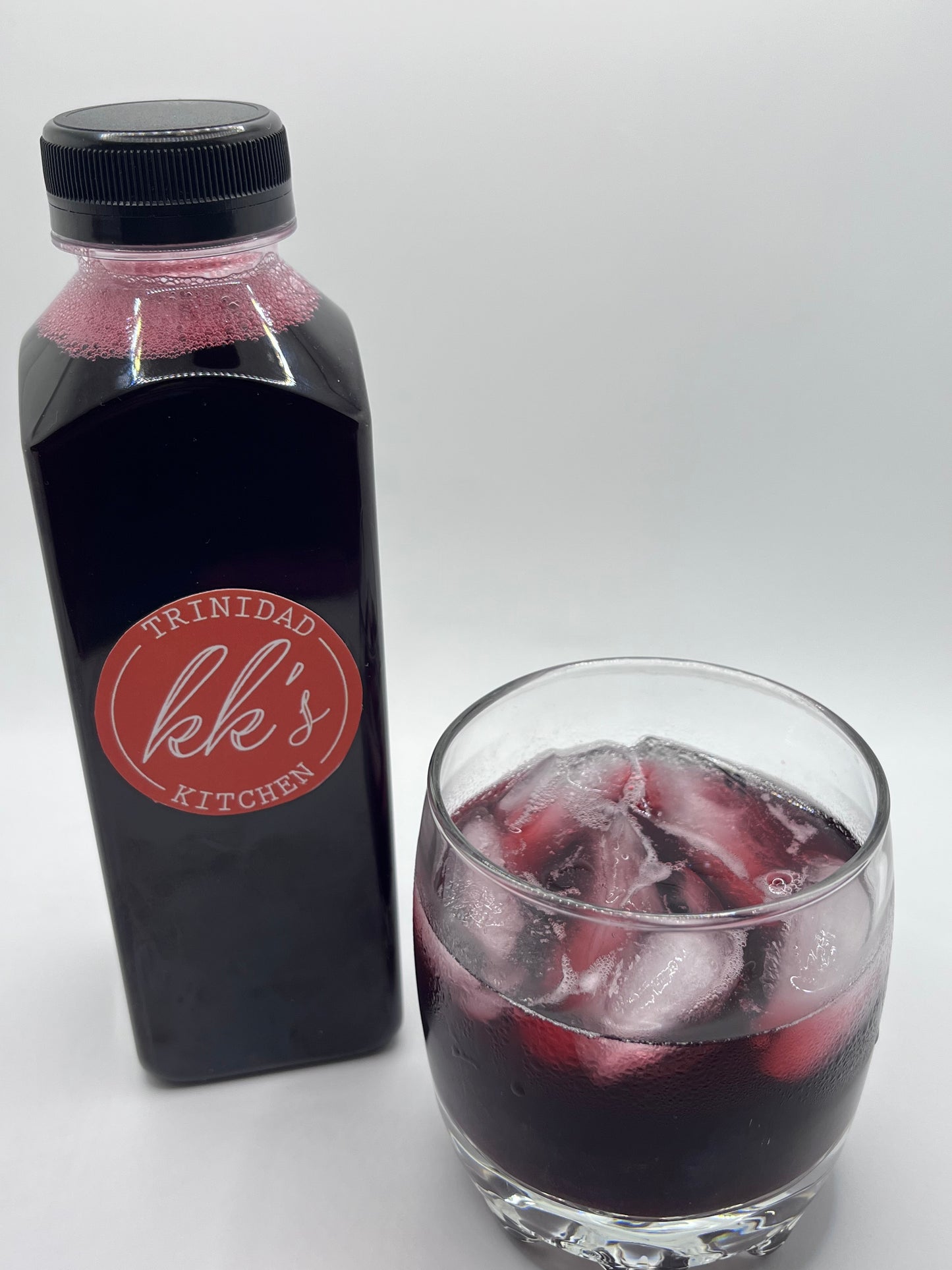 Single 16oz bottle of KK's Trinidad Kitchen Sorrel close-up