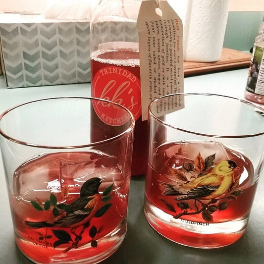 KK's Trinidad Kitchen Rum Punch served in decorative bird glasses
